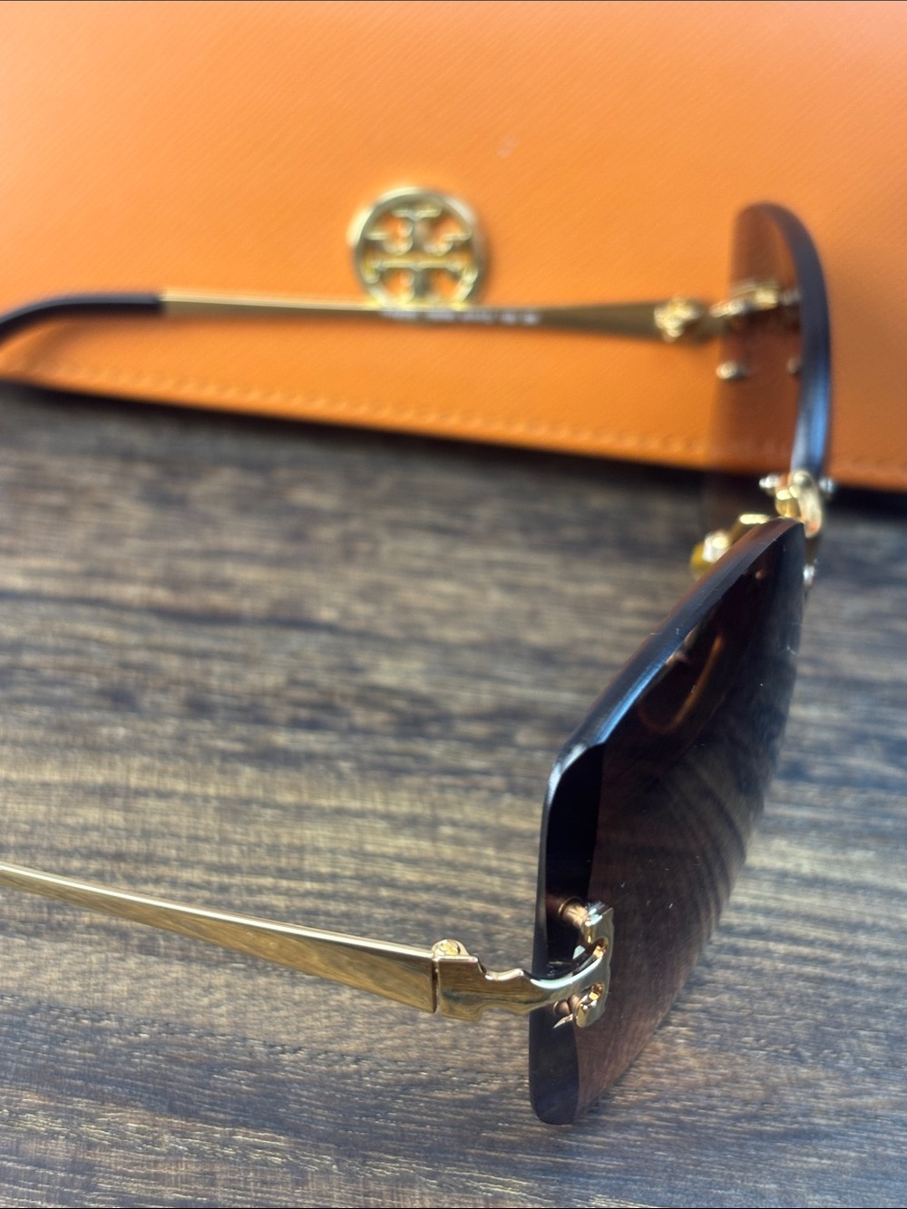 Tory Burch Brown Gradient Rimless Sunglasses with Gold Accents and Orange Case - Picture 4 of 10